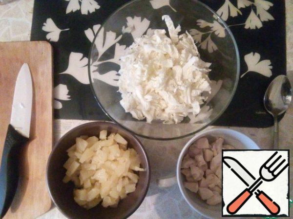 I boiled the chicken, poured out the pineapple, and sliced the cabbage.