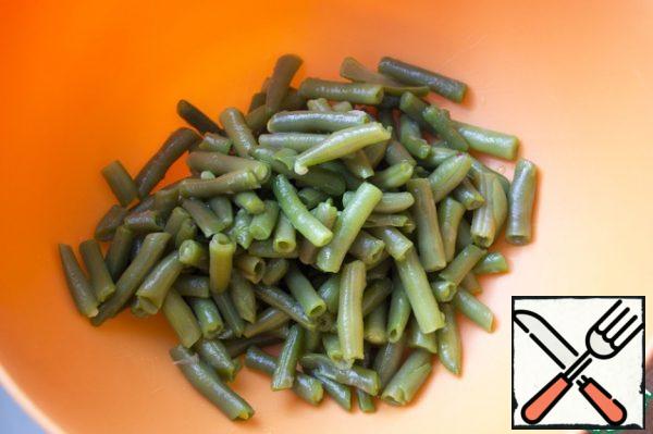 Also boil the string beans. Toss in a colander, rinse with cold water.