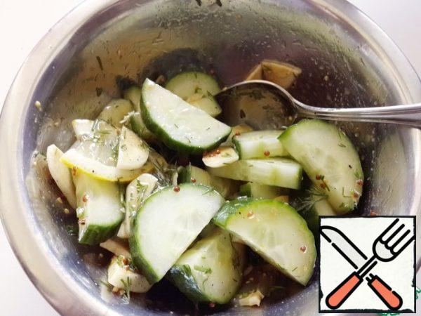 Pour the dressing over the cucumbers and lemon, and mix.