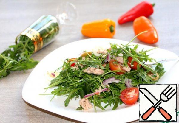 Serve the salad immediately.