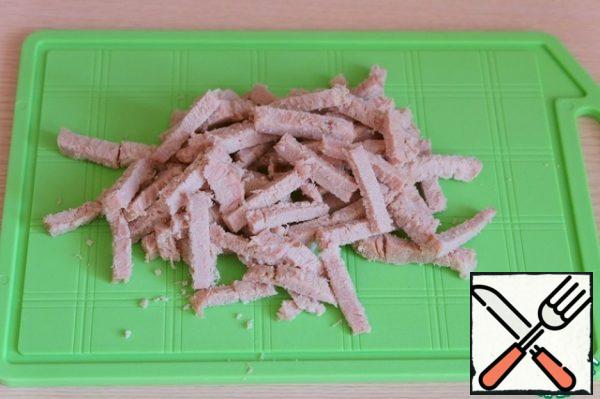 Boil pork in salted water, cut into cubes.