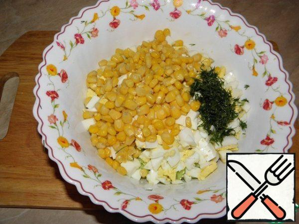 Then add the chopped dill and corn (drain the liquid).