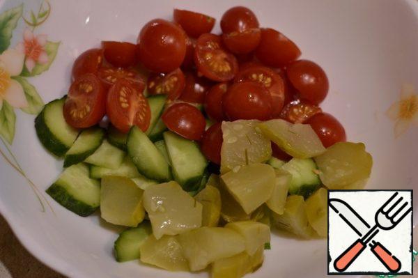 Cherry cut in half, mix with cucumbers.