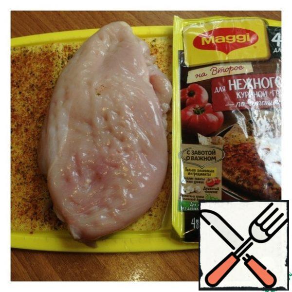 Lightly chop the chicken breast and put it on a sheet with seasonings on one side, press and cover with the second half of the paper. Fry the breast in a dry pan on both sides for 7 minutes on each side.