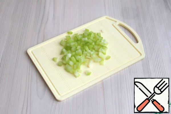 Cut the celery stalk into small cubes.