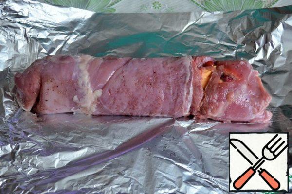 Twist it into a tight roll, transfer it to the foil. Wrap in three layers of foil.