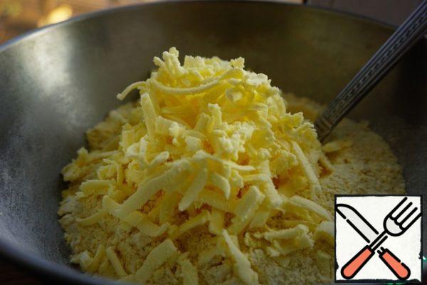 Rub butter into flour on a coarse grater.