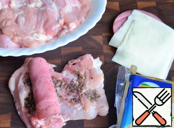 
Roll the ham with cheese roll. Then wrap the meat over the thighs.