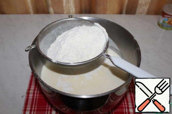 Add sifted flour with baking powder and vanilla. Beat well.