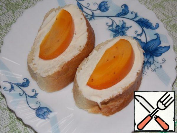 Place persimmon slices on a loaf.