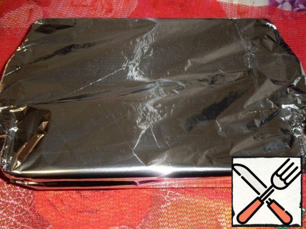 Cover the form with foil and send to the oven.