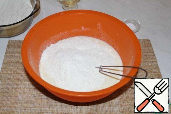Gradually add flour. Mix again.