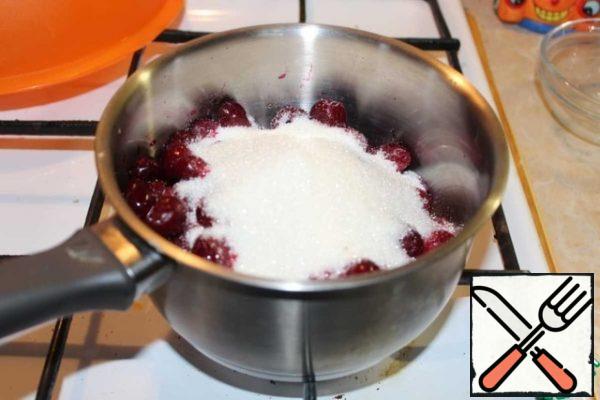 
Put the cherries and sugar in a saucepan. Simmer until sugar dissolves.