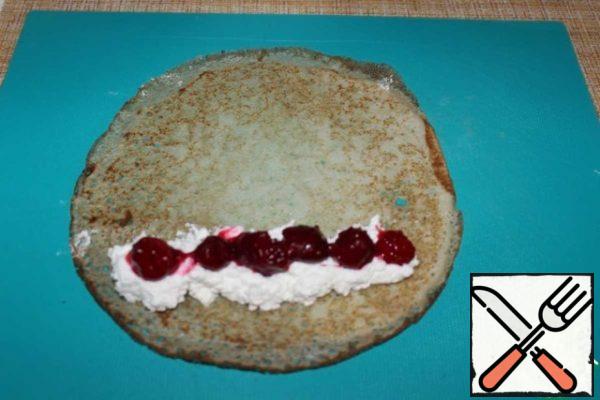 Put cottage cheese with powdered sugar on a pancake, and cherries on top.
