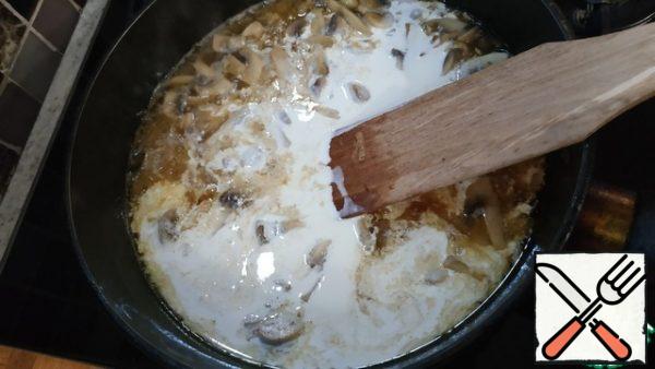 Pour in the wine and cream. Add salt and pepper and simmer over medium heat for 7 minutes.