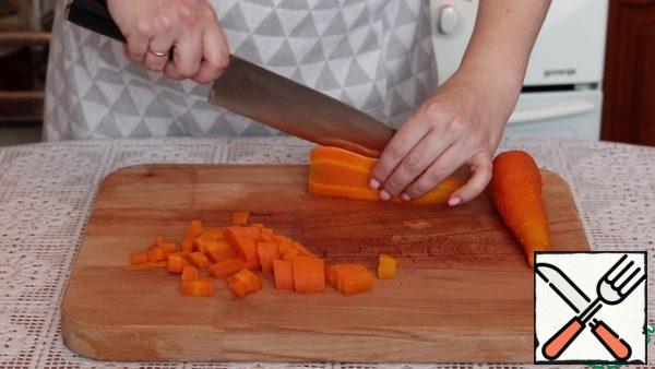 Carrots are washed, boiled and cut into cubes.