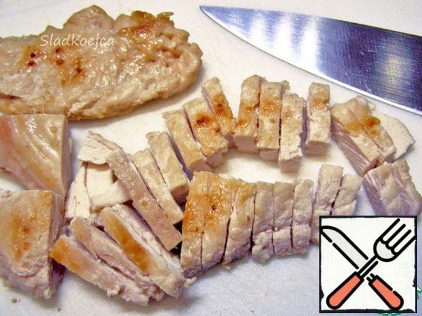 Boil or fry the chicken fillet.