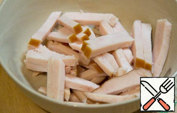 Cut the breast into strips.