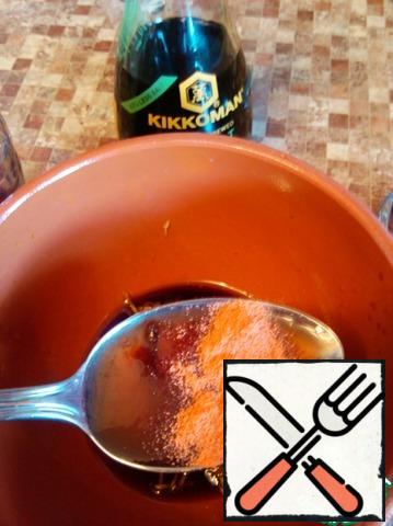 For the marinade, mix soy sauce , grated garlic, plum jam and sweet paprika.