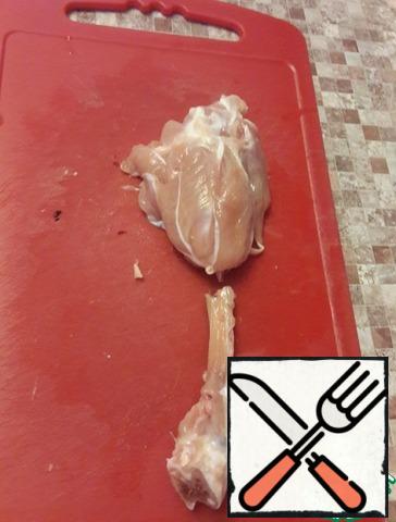 At the chicken leg, cut the meat around the bone and turn it inside out, cut the bone at the base.