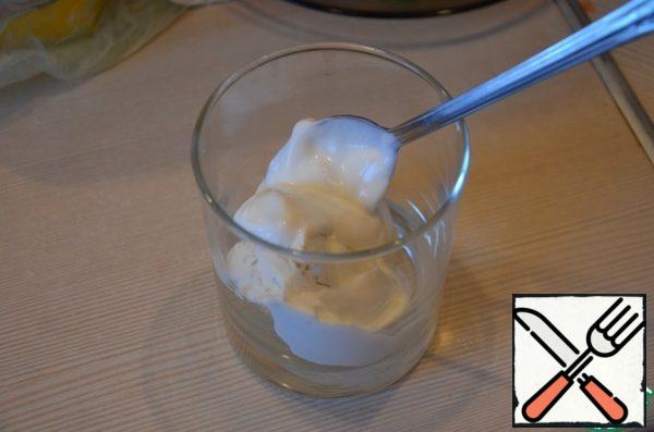 Cottage cheese is mixed with sour cream, spices, herbs .