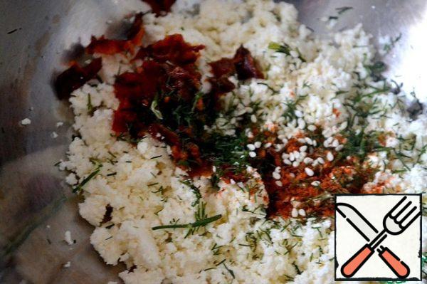 Chop the cheese, add 2 tablespoons of olive oil, sesame seeds, finely chopped dill and paprika.