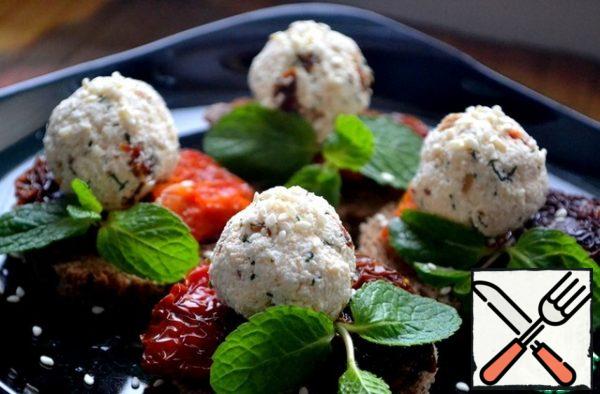 Put the cheese balls, decorate with herbs, sprinkle with sesame seeds and serve. The snack can be made in advance, it is perfectly in the refrigerator.
This will greatly help the housewives in the New Year's rush and kitchen chores.