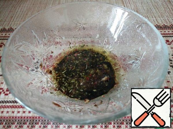 Add grated garlic, herbs of Provence, salt, pepper and vinegar to the olive oil.