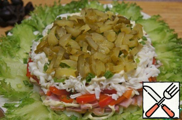 Then come the pickled cucumbers, cut into strips.