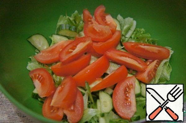 Add the sliced tomatoes.