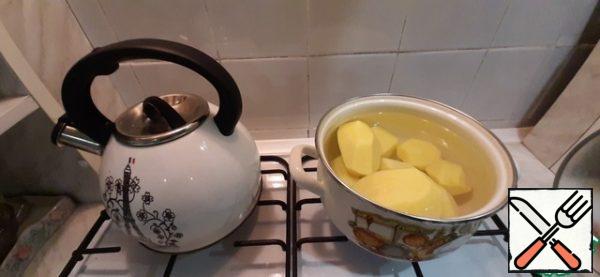 Peel and cook the potatoes.