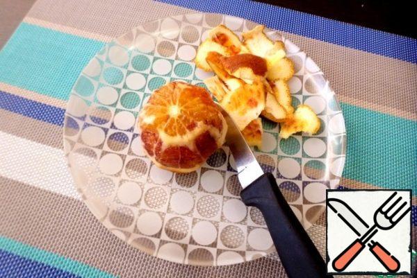 Cut the skin from the orange. I have a small red orange.