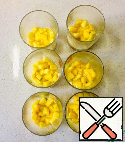 Next, layer the mango until it covers the cream
