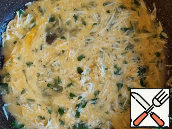 Finely chop the parsley. Add half to the eggs. Grate the parmesan in the same place.