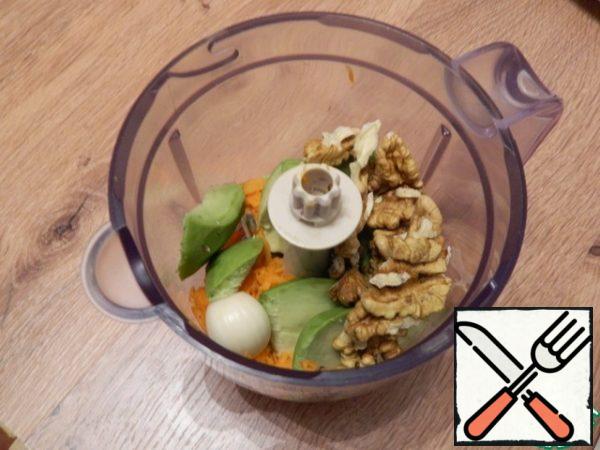 Add a clove of garlic, nuts, and a pinch of ground coriander.