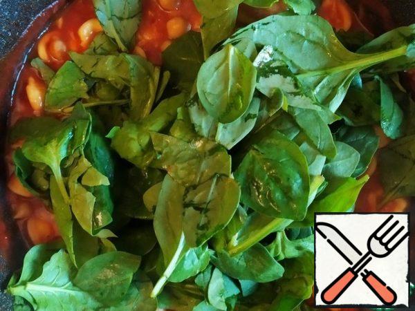 Add spinach. Cook until the spinach wilts and the cheese melts.