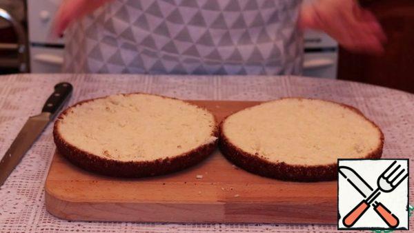 Completely cooled sponge cake cut into 2 parts.