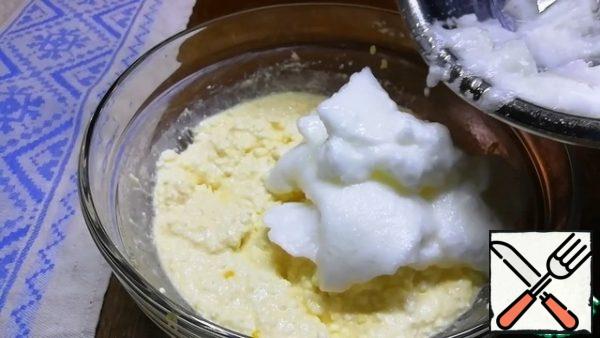 Transfer the whipped whites to the curd mass and gently mix.