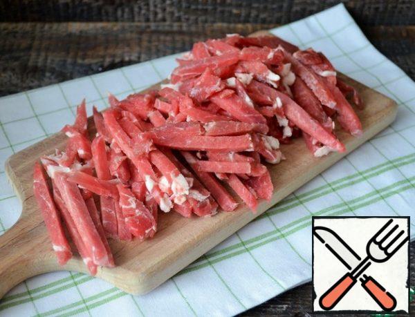 Frozen beef cut into thin bars, let thaw.