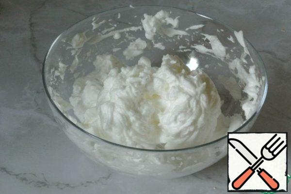 In a separate bowl, whisk the whites into a fluffy mass.