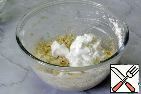 Gently add the whipped whites to the oatmeal dough.