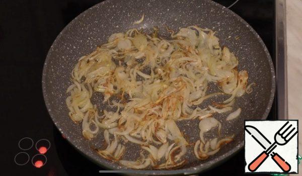 Fry the chopped onion until golden brown.