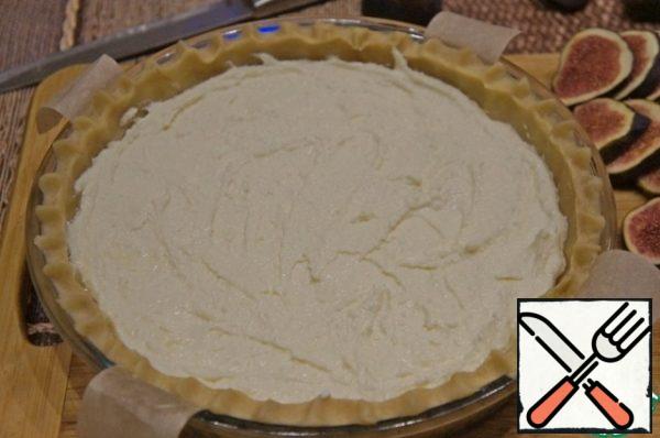 Then pour out the curd mass and smooth it out.