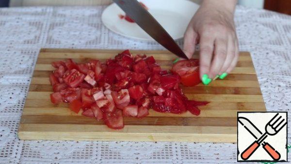 Tomatoes are also cut into cubes.
