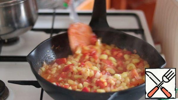 Add tomatoes and pepper. Simmer until soft. The sauce is ready.