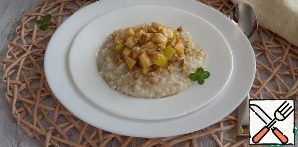 Spread the porridge on a plate. Add the apple, nuts and honey.
Serve, garnished with mint.Bon Appetit!!!