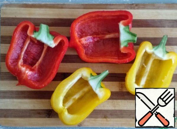 Wash the pepper well, cut it in half, and remove the seeds.