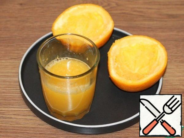 Squeeze the juice out of the orange.