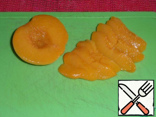 Canned peaches cut into slices.