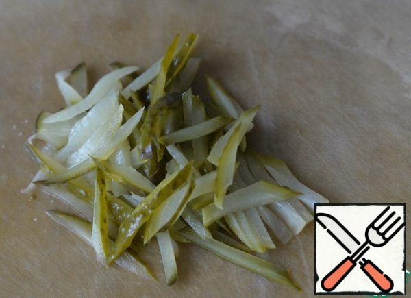 Pickled cucumbers are also cut into strips.